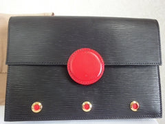 Vintage Louis Vuitton black epi mod clutch purse, shoulder bag with a red eye bull design closure. Rare masterpiece.