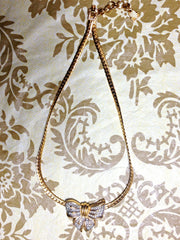 Vintage LANVIN golden thick chain statement necklace with large ribbon bow and crystal stone pendant top. Perfect vintage jewelry.