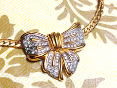 Vintage LANVIN golden thick chain statement necklace with large ribbon bow and crystal stone pendant top. Perfect vintage jewelry.