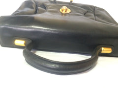 Vintage Bally black leather retro pop design bag, business purse with gold tone drawstrings and unique flap cut design.  Unisex use