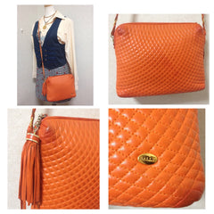 Vintage BALLY rare color, orange quilted lambskin golden chain shoulder purse with golden motif and matching tassel.