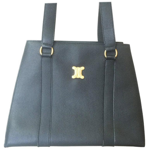 Vintage CELINE black trapezoidal tote with red lining and gold tone Celine logo charm.