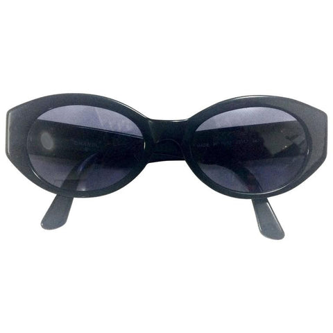 Vintage CHANEL black oval frame sunglasses with golden CC