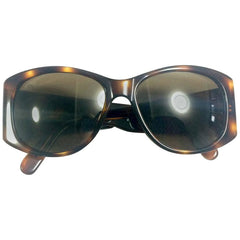 Vintage CHANEL brown frame sunglasses with large CC charms at sides. Mod and chic eyewear you must get.