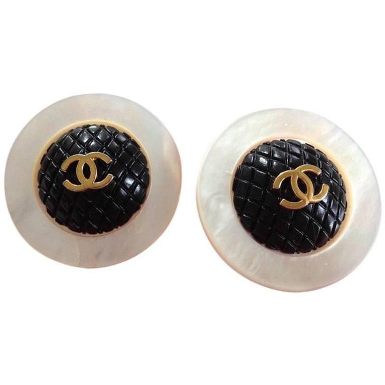 Authentic vintage Chanel earrings gold CC logo black button round