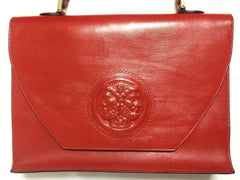 Vintage FENDI genuine red leather classic handbag with iconic Janus medallion embossed motif at front.
