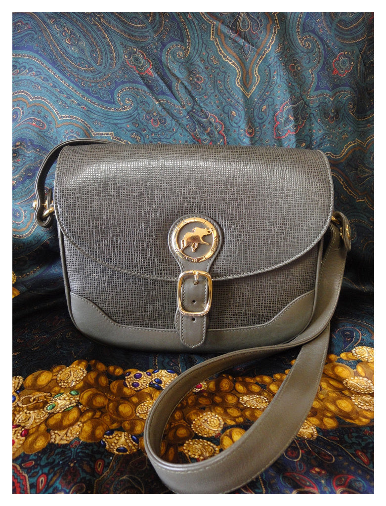 Vintage Hunting World khaki genuine leather shoulder purse with iconic gold tone elephant logo charm at front