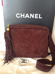 Vintage CHANEL dark brown V stitch suede leather shoulder bag with CC stitch mark and long tassel. Best Chanel purse for fall and winter.