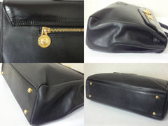 Vintage Gianni Versace genuine black leather Kelly style bag with Medallion Sunburst charms . Gorgeous masterpiece