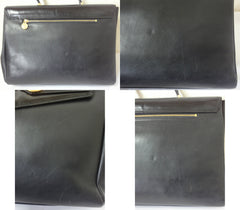 Vintage Gianni Versace genuine black leather Kelly style bag with Medallion Sunburst charms . Gorgeous masterpiece
