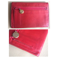 Vintage CHANEL classic leather wallet purse, card case in red color with large CC stitch logo and golden charm.