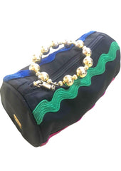 Vintage Moschino by Redwall tube shape black pouch bag with pink, green, and blue wave trimming and gold tone ball design handle. Rare, chic and mod pouch bag.