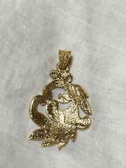 MINT. Vintage Yves Saint Laurent golden arabesque design pendant top. YSL leaf design top. Enjoy it with your own necklace.