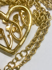 Vintage Moschino golden chain necklace with large arabesque heart design pendant top. Moschino BIJOUX jewelry.