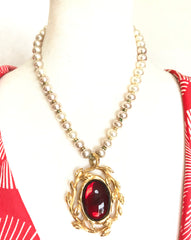 Vintage Lanvin faux pearls and golden arabesque and red stone pendant top statement necklace. Gorgeous German made jewelry masterpiece.