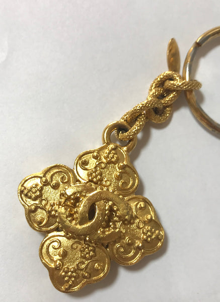 Vintage CHANEL gold tone arabesque clover, flower shape CC key holder, – eNdApPi  ***where you can find your favorite designer vintages..authentic,  affordable, and lovable.