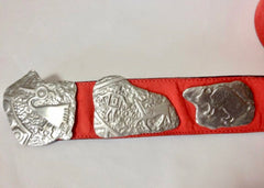 Vintage Carlos Falchi red suede leather belt with silver fun and unique animal motifs. Great masterpiece. US28, 29, 30, 31, 32, 33