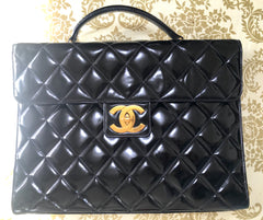1990s. Vintage CHANEL black patent enamel briefcase business bag with golden large CC motif. Classic and traditional masterpiece you must have.
