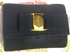 Vintage Salvatore Ferragamo black leather shoulder mini bag with golden chain and Vara bow motif. Clutch purse from Vara collection. R041011