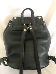 Vintage MCM black backpack with golden studded logo motifs and drawstrings. Designed by Michael Cromer. Unisex bag for daily use.