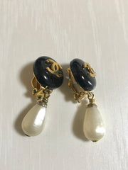 Vintage CHANEL teardrop white faux pearl earrings with black and golden CC mark on top. Chanel dangle earrings. Beautiful jewelry gift.