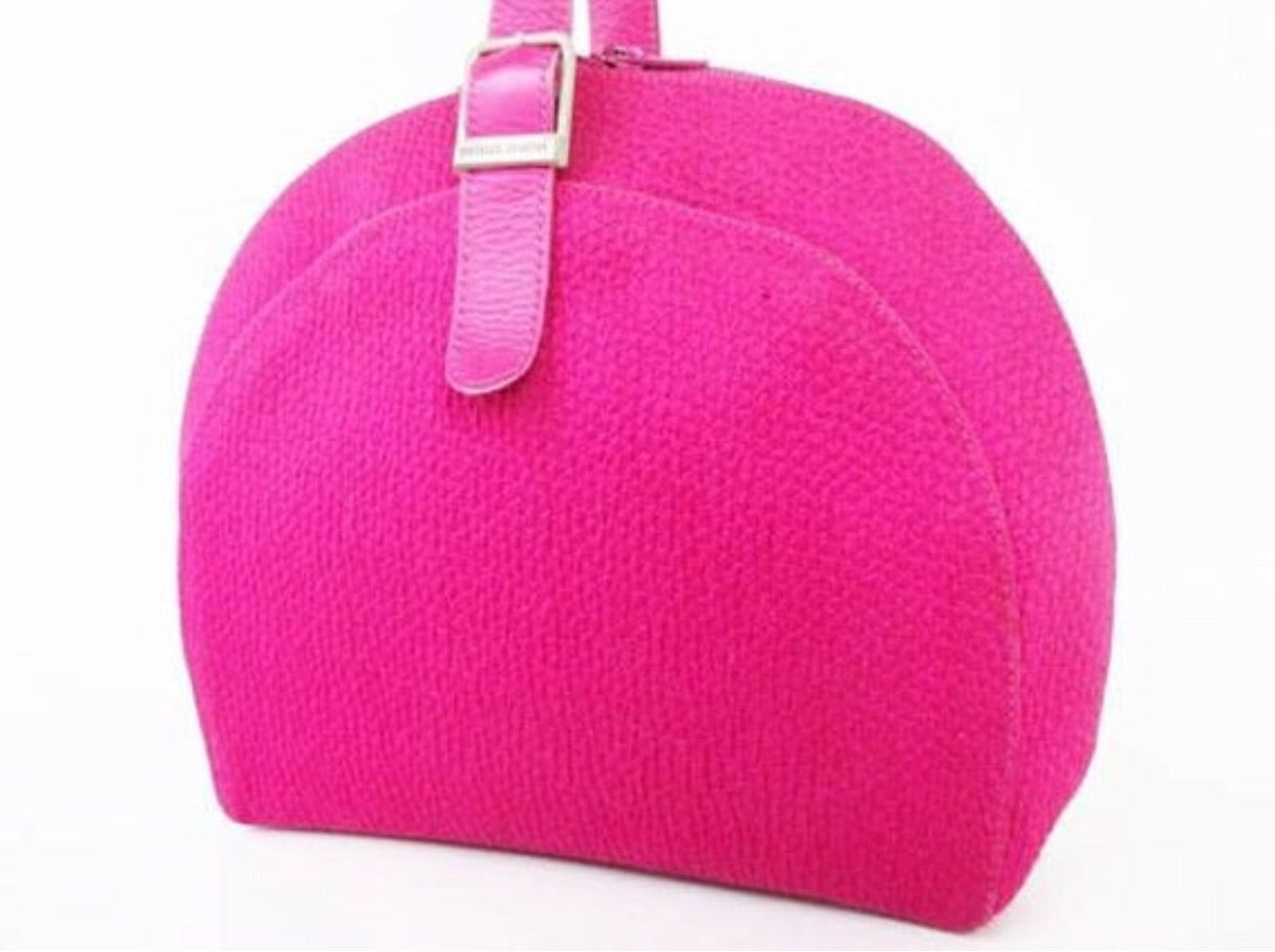 Vintage Charles Jourdan pink satin bag in round shape with logo motif and leather strap.