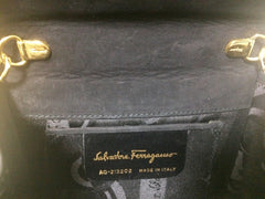 Vintage Salvatore Ferragamo black leather shoulder mini bag with golden chain and Vara bow motif. Clutch purse from Vara collection. R041011