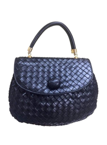 Vintage Bottega Veneta black intrecciato, woven lambskin handbag with a matching turn-lock closure.
