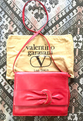 Vintage Valentino Garavani orange red leather clutch shoulder bag with a large gathered buckle design flap and V motif. Must have.