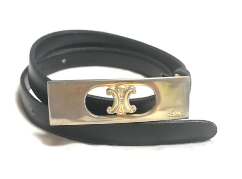 Vintage Celine black leather belt with gold tone logo motif buckle. 60cm through 69cm. 23.5”- 27”.