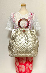 Vintage CHANEL campaign gold lamb leather hobo bucket bag with marble hoop handles and turn lock CC. 0412081