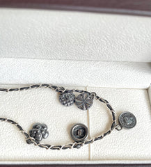 MINT. Vintage CHANEL skinny silver chain necklace with symbolic coin charms and black leather. Can be bracelet too.