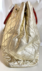 Vintage CHANEL campaign gold lamb leather hobo bucket bag with marble hoop handles and turn lock CC. 0412081