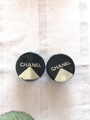 Vintage Chanel round earrings with silver and black mod design.