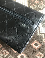 1980s. Vintage CHANEL black goatskin bill, card, checkbook long wallet pouch purse with  mini CC motif.  Classic unisex style.