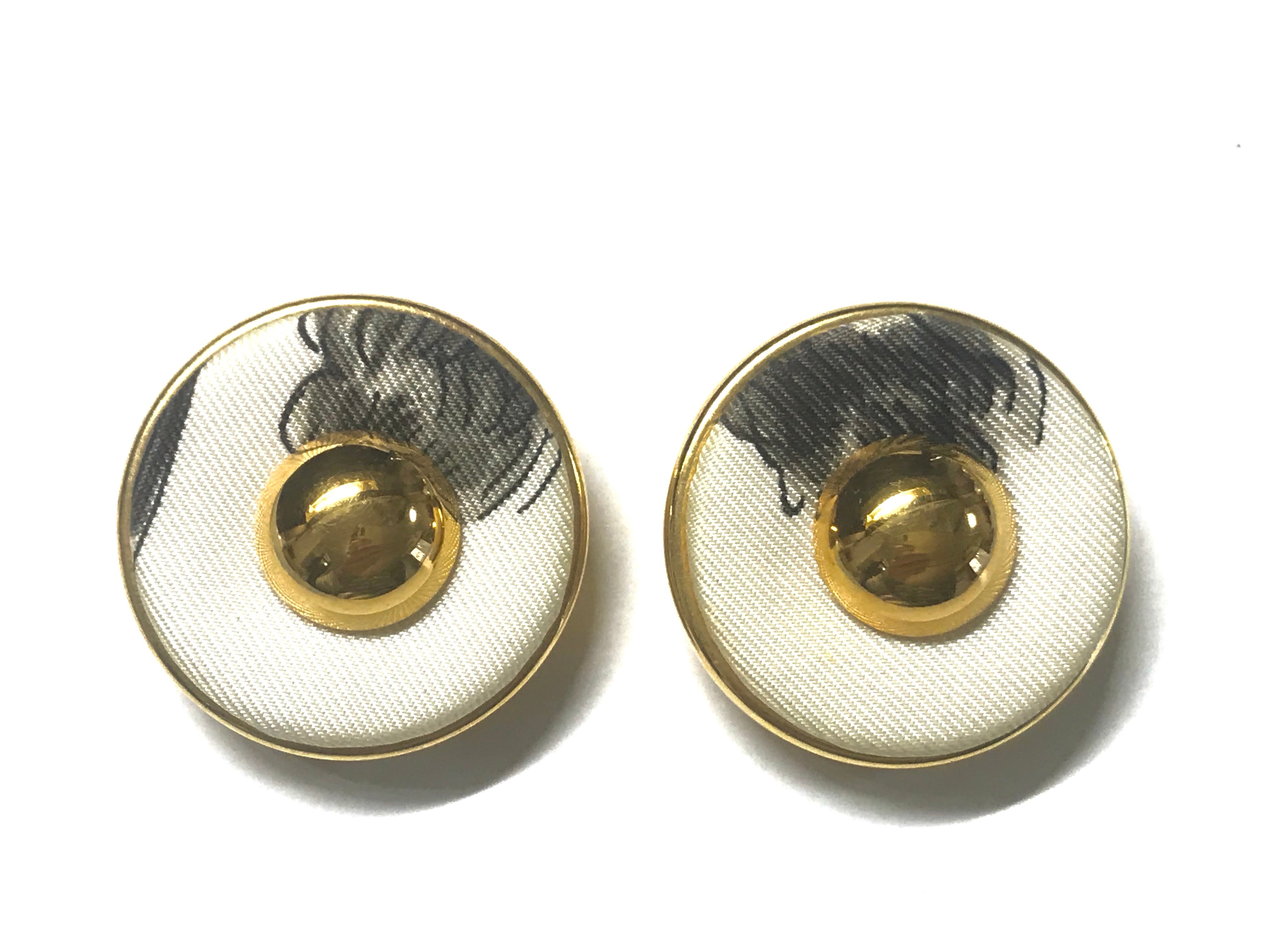 Vintage HERMES golden round earrings with white silk fabric frames. Classic jewel piece.