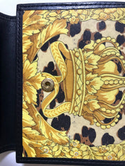 Vintage Gianni Versace black leather card case wallet with its iconic leopard, crown, and jewelry print. Unisex use.