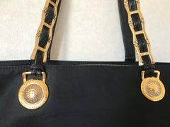 Vintage Gianni Versace large black nylon and leather combination tote bag with gold tone sunburst motifs and chains. Lady Gaga Style