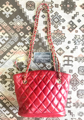 Vintage CHANEL lipstick red quilted lambskin leather trapezoid shape tote bag with a gold CC plate and chains.