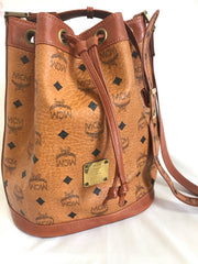 Vintage MCM brown monogram hobo bucket shoulder bag. Designed by Michael Cromer. Unisex use. Must have daily use bag.