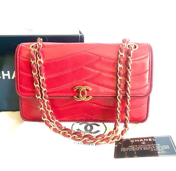 Vintage Chanel red 2.55 shoulder bag with wavy stitches and rope strings  and gold chain strap. Very rare piece from the era. 050316r4