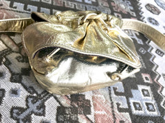 Vintage Carlos Falchi golden metallic leather mini fanny pack. Can use as pouch and belt. Belt would fit 26.3" through 31.5"