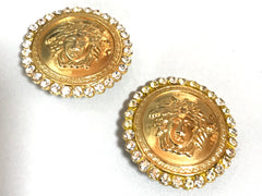 Vintage Gianni Versace large round gold tone medusa face earrings with crystal glasses. Must have Lady Gaga style jewelry piece.