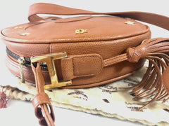 Vintage MCM suzy wong bag, brown grained leather round shoulder bag with studs and fringes. Designed by Michael Cromer.