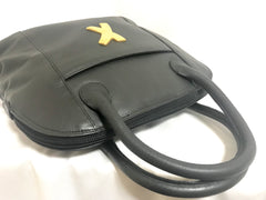 Vintage Paloma Picasso black leather bolide bag style handbag with iconic golden logo motif. Classic shape bag.