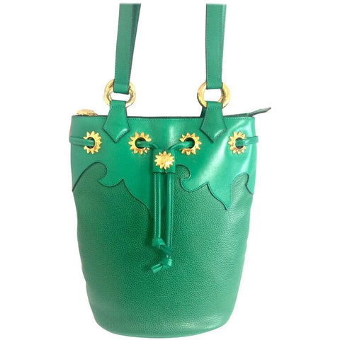 Vintage Christian Lacroix genuine grained green leather hobo bucket shoulder bag with golden sun motifs. Hot masterpiece
