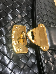 1990s. Vintage Bottega Veneta classic black lamb leather intrecciato handbag with golden closure hock. Gorgeous masterpiece from Bottega.