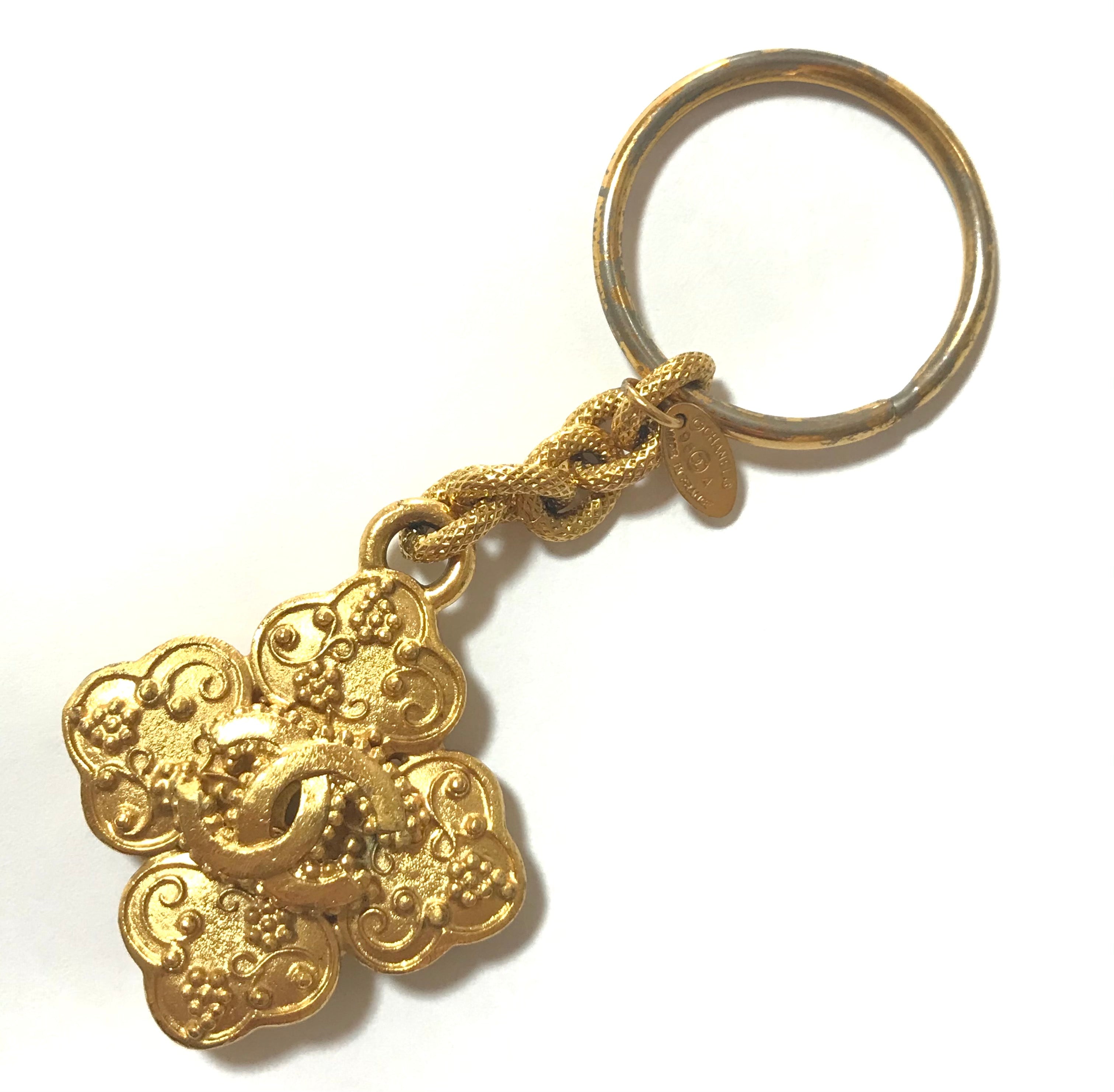 Vintage CHANEL gold tone arabesque clover, flower shape CC key