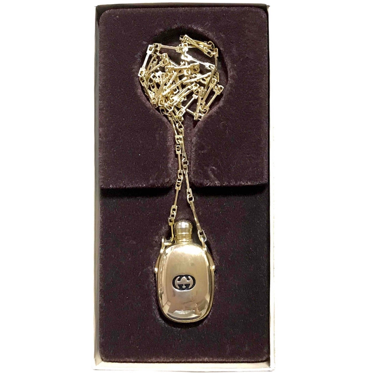 Vintage Gucci golden perfume bottle necklace with logo mark on top. Gorgeous rare masterpiece from 80's. 0410271