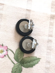 Vintage Chanel round earrings with silver and black mod design.